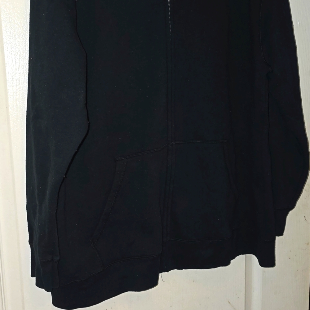 A women's hoodie in black with  pink love emblem and breast cancer ribbon